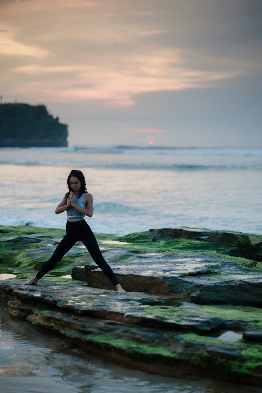 A woman practicing yoga in a weight-loss-themed class